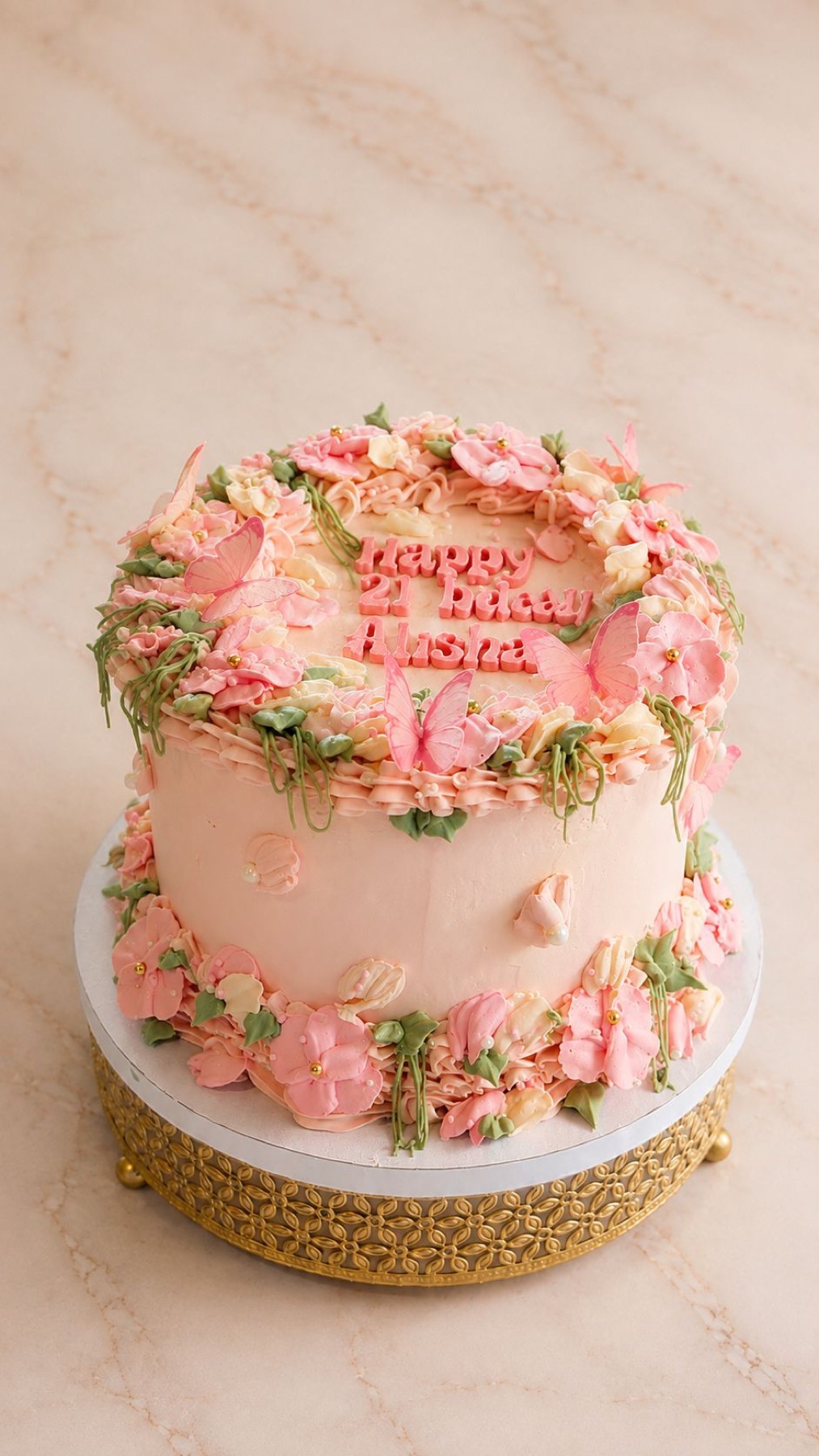 Pink floral custom birthday cake with butterflies