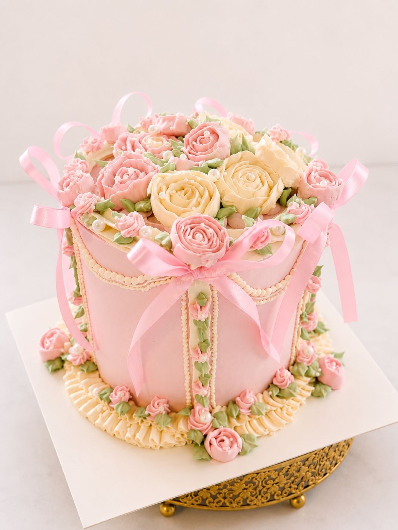 Pink square floral cake with ribbon bows
