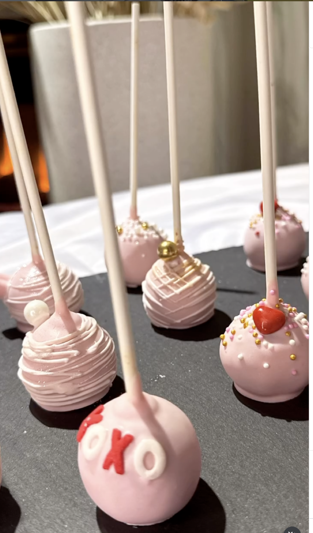 Pink cake pops with gold and white sprinkles