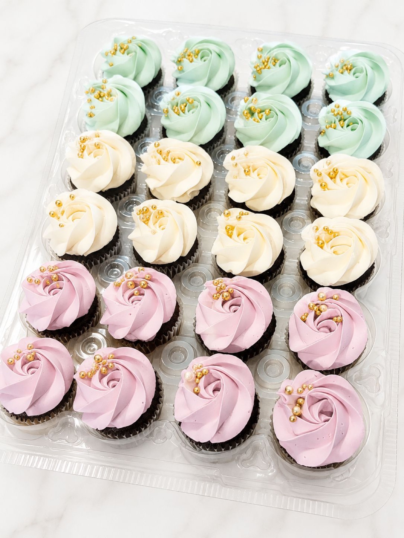 Pastel cupcakes with gold pearls