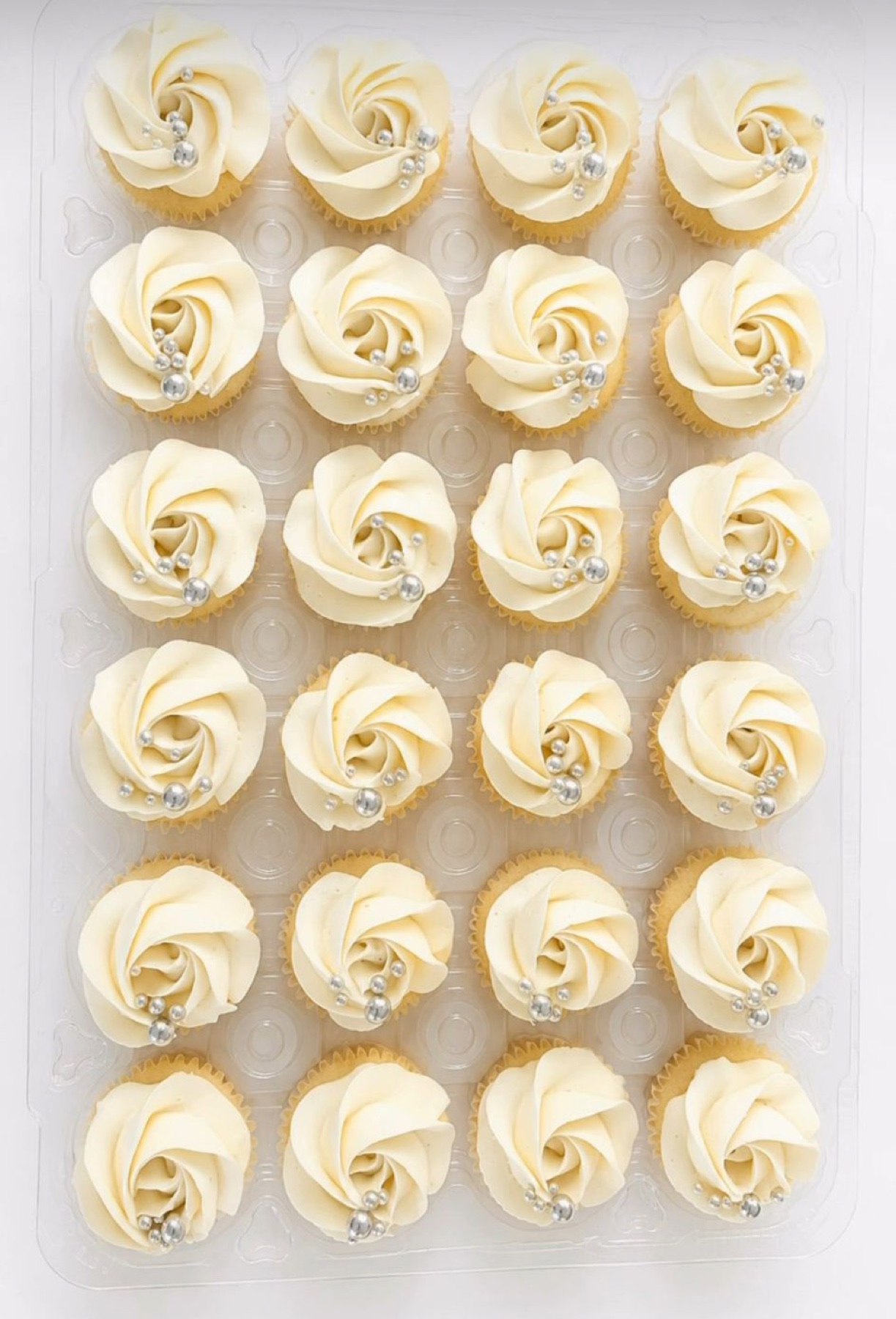 Ivory cupcakes with silver pearls