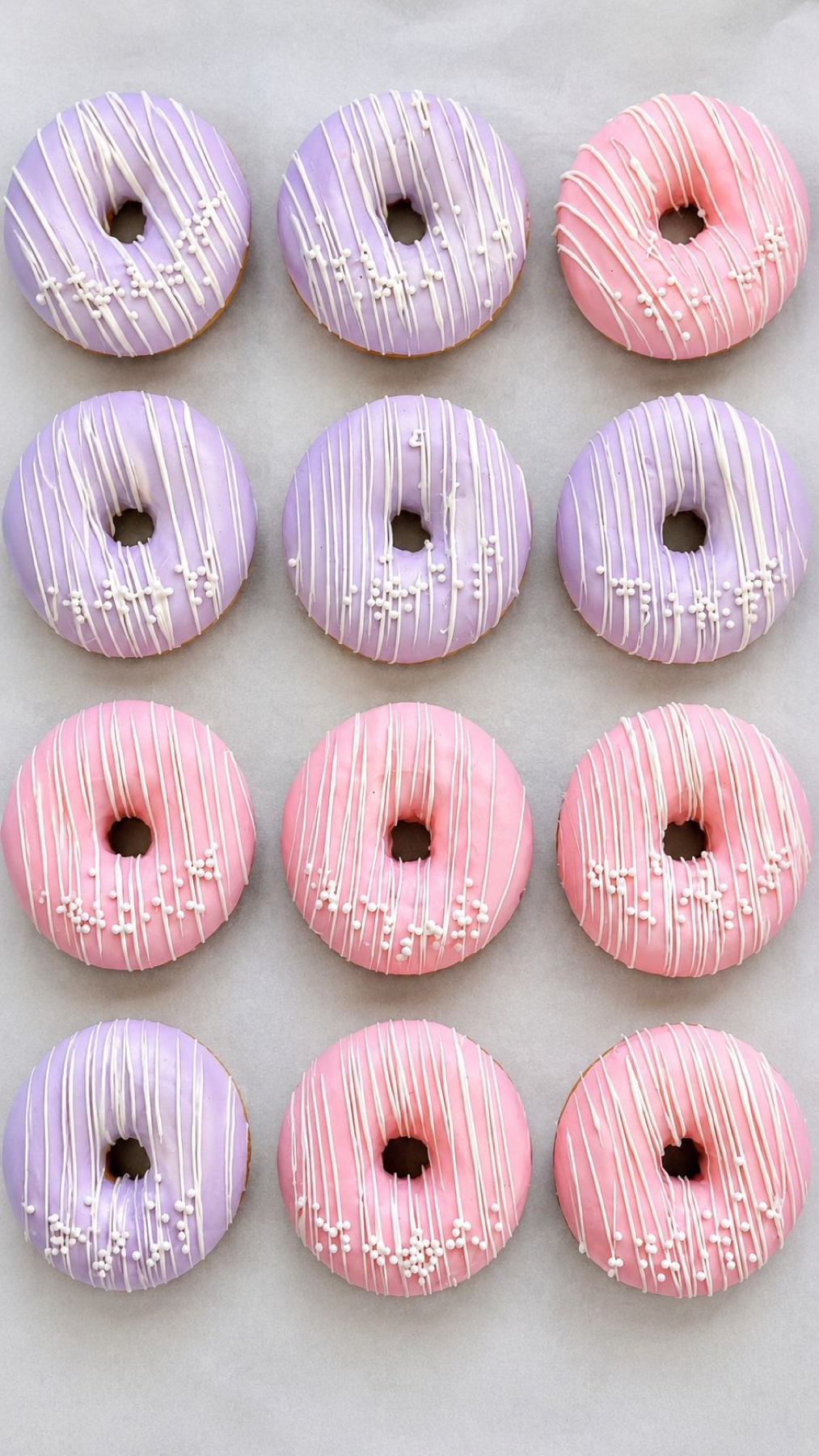 Pink and lavender chocolate covered donuts